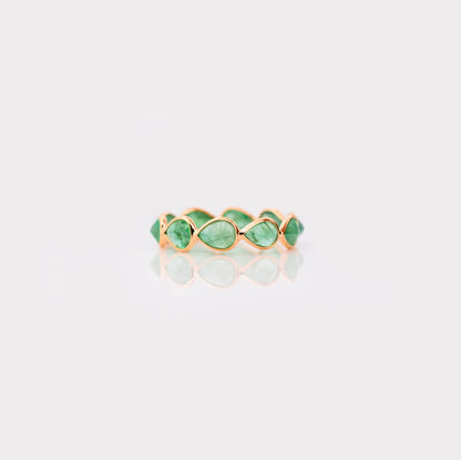 18K gold eternity ring with alternating pear-cut emeralds