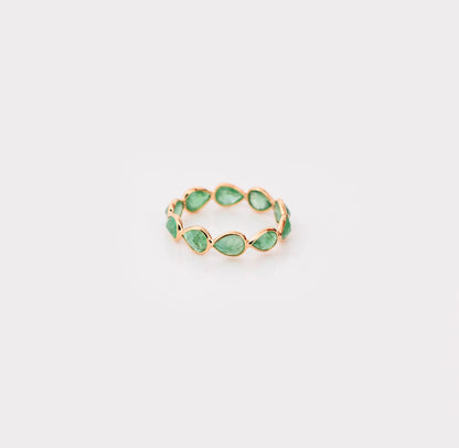 18K gold eternity ring with alternating pear-cut emeralds