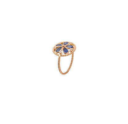 18K gold flower cluster ring with blue sapphire petals and a center diamond