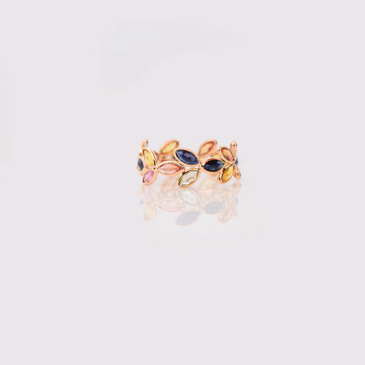 18K gold ring with marquise-cut rainbow sapphires in a leaf and vine motif