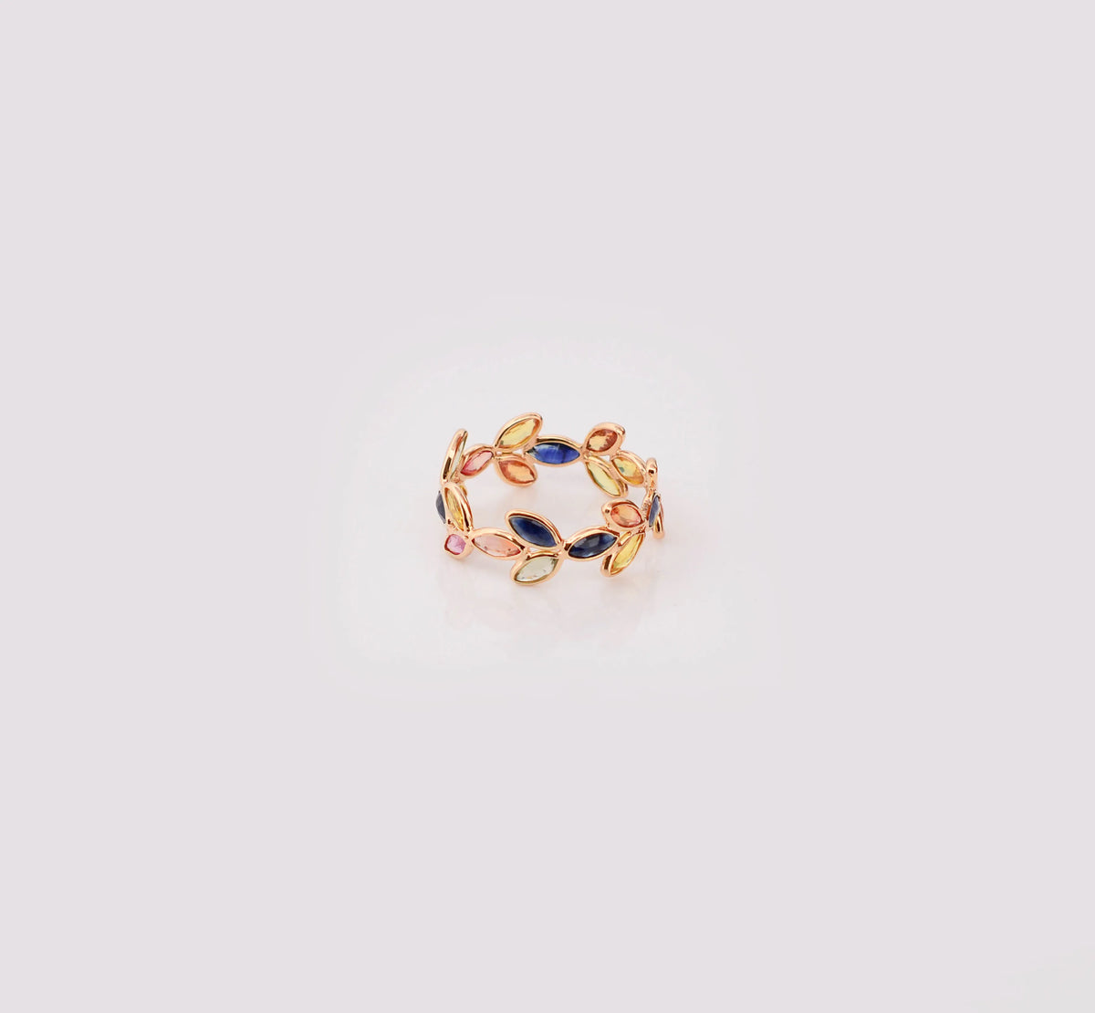 18K gold ring with marquise-cut rainbow sapphires in a leaf and vine motif
