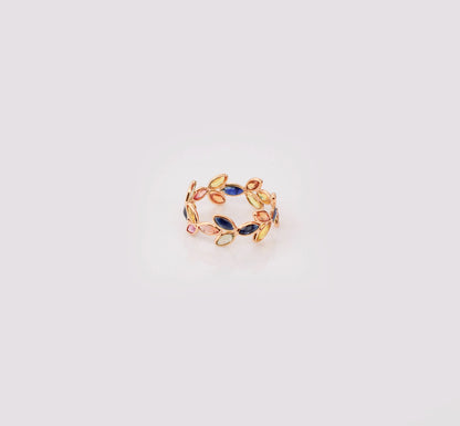 18K gold ring with marquise-cut rainbow sapphires in a leaf and vine motif