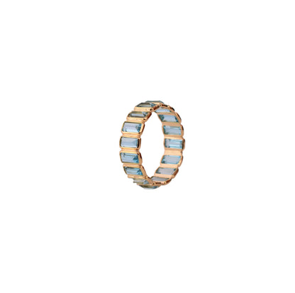 18K gold eternity ring with baguette-cut Swiss blue topaz stones