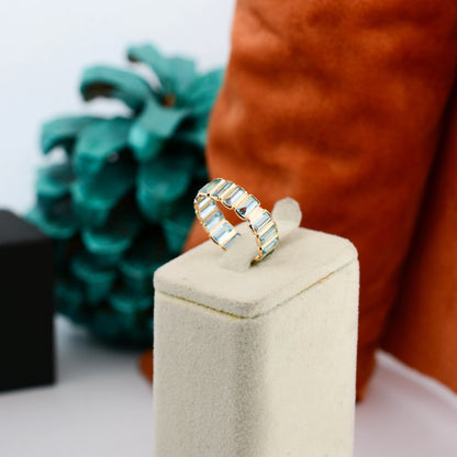 18K gold eternity ring with baguette-cut Swiss blue topaz stones