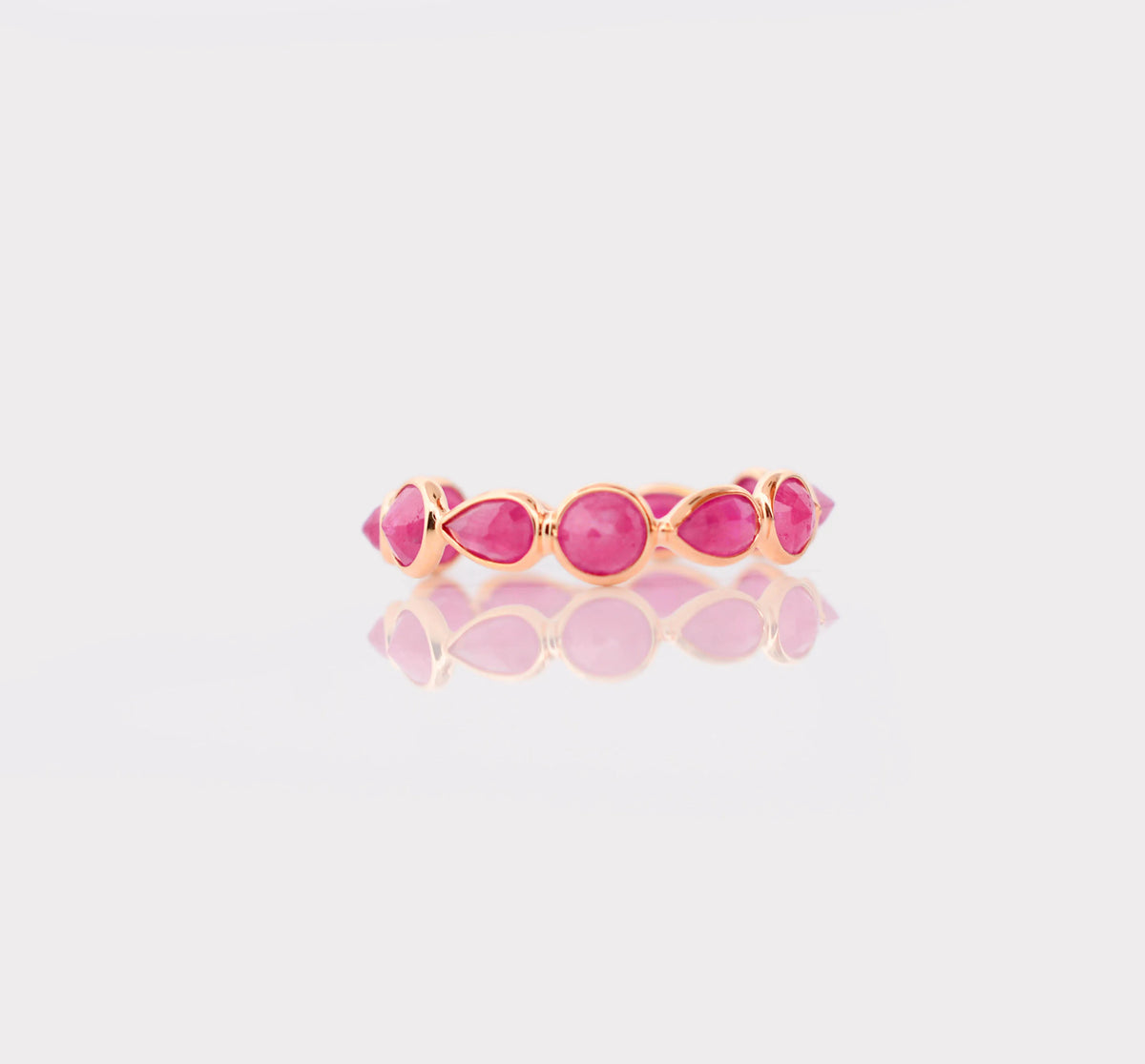 18K gold eternity ring with alternating round and pear-cut rubies