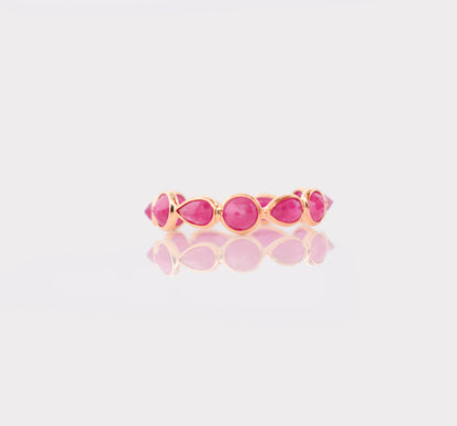 18K gold eternity ring with alternating round and pear-cut rubies