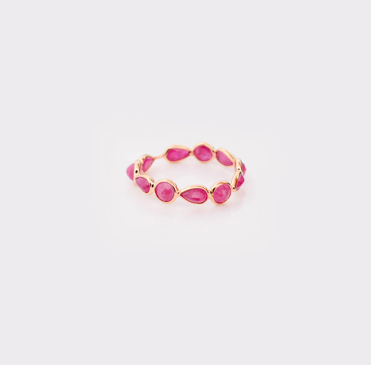 18K gold eternity ring with alternating round and pear-cut rubies