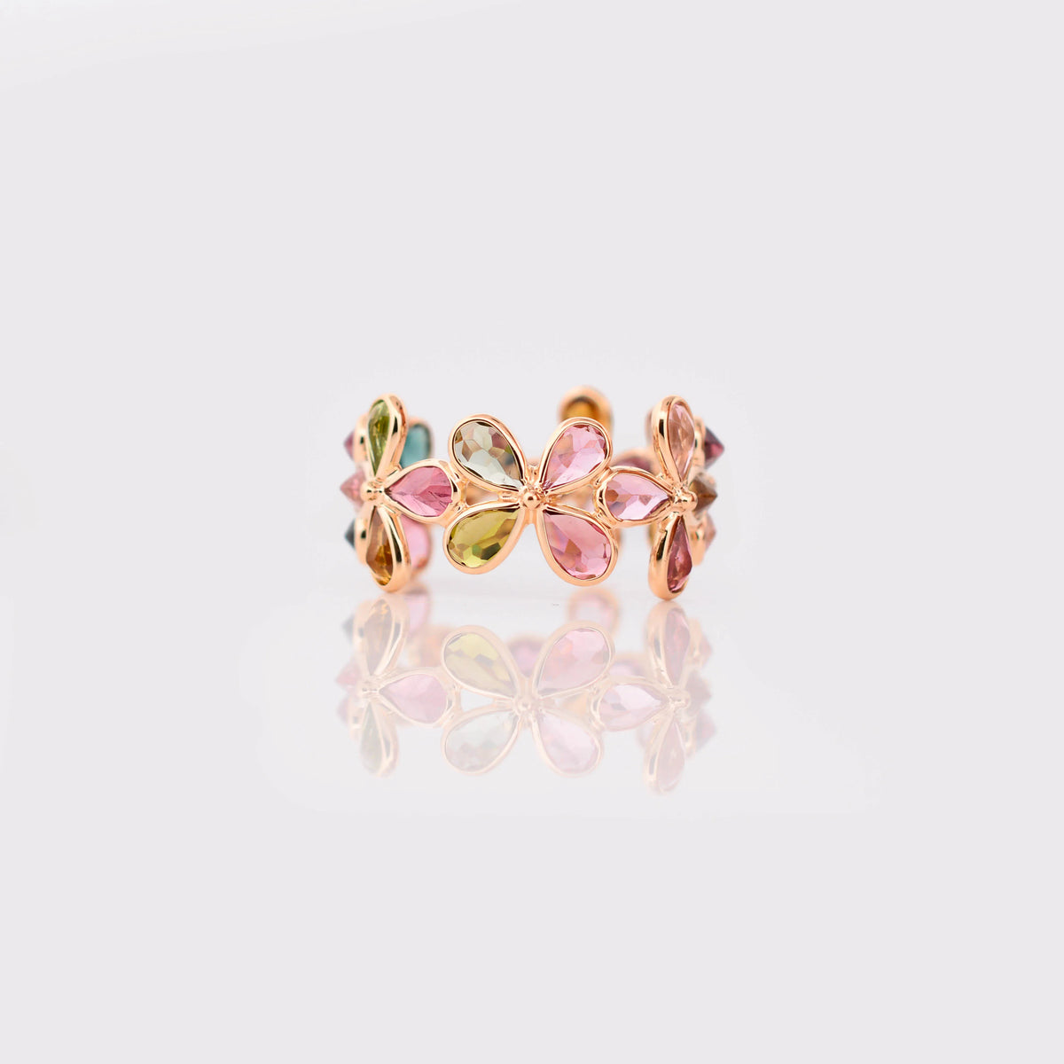 18K gold ring with pear-cut multicolor tourmaline in a floral cluster design