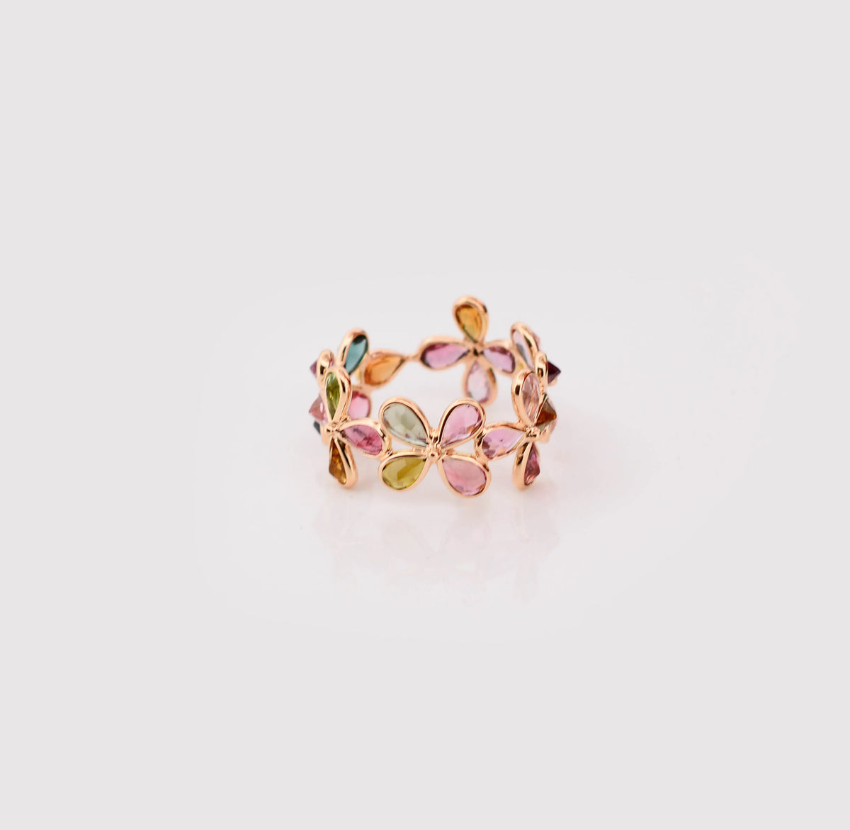 18K gold ring with pear-cut multicolor tourmaline in a floral cluster design