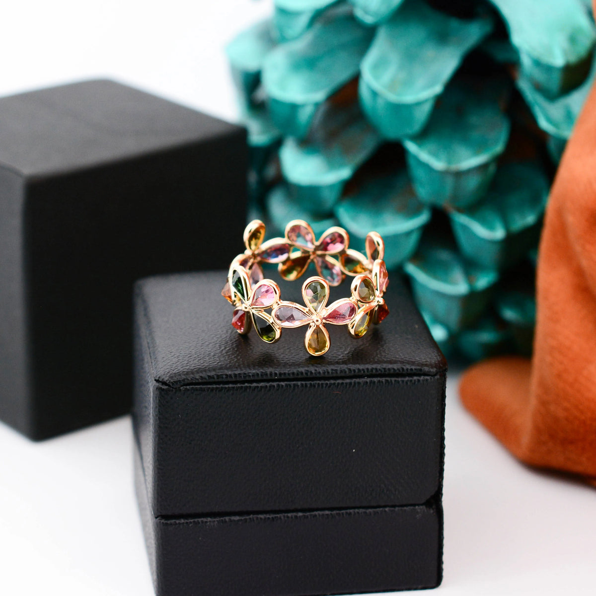 18K gold ring with pear-cut multicolor tourmaline in a floral cluster design