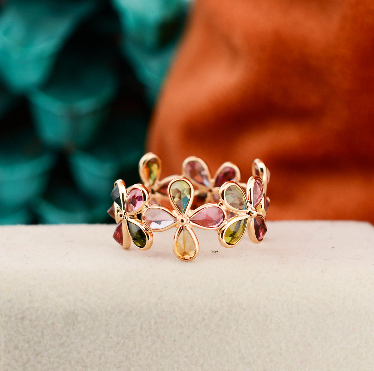 18K gold ring with pear-cut multicolor tourmaline in a floral cluster design