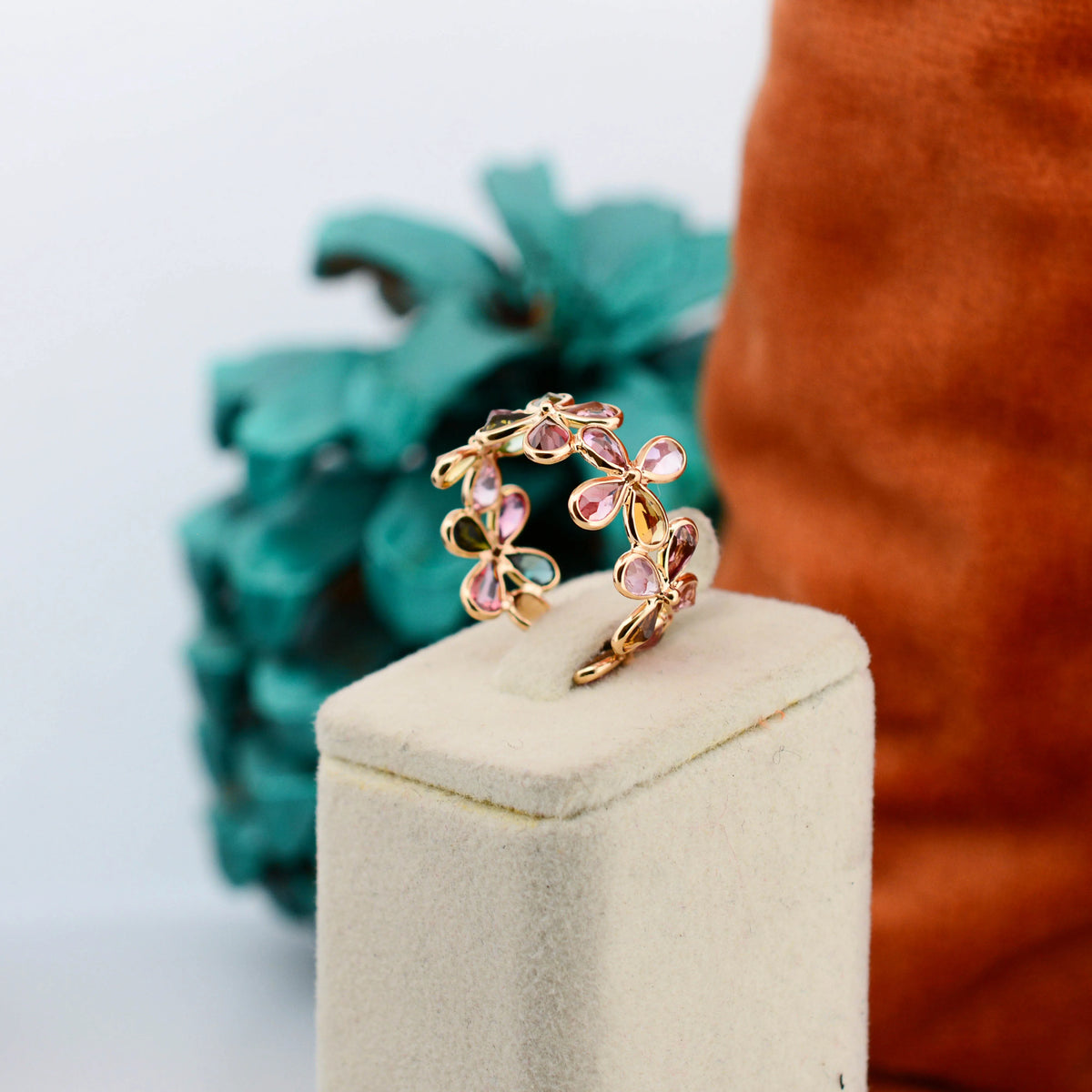 18K gold ring with pear-cut multicolor tourmaline in a floral cluster design