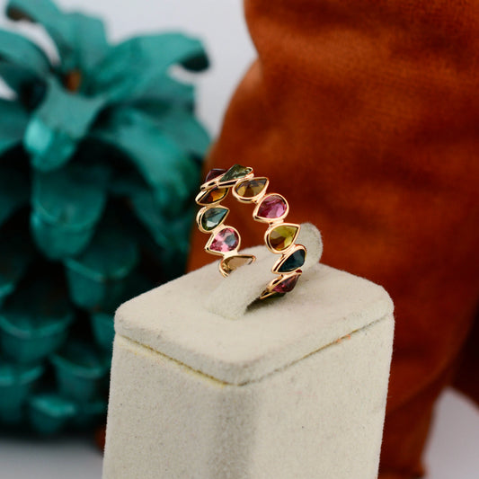 18K gold eternity ring with multicolor pear-cut tourmaline stones