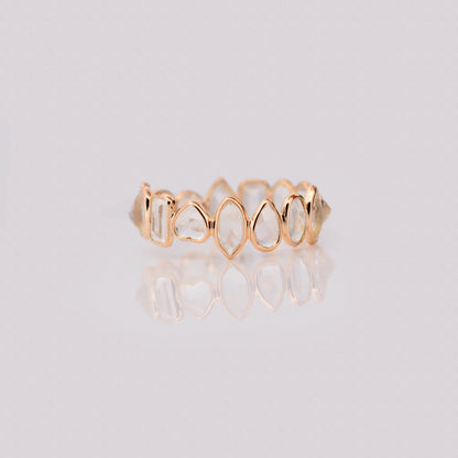 18K gold eternity ring with mixed-cut rainbow moonstone stones