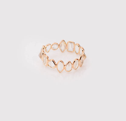 18K gold eternity ring with mixed-cut rainbow moonstone stones