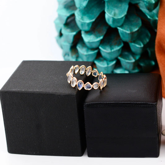18K gold eternity ring with mixed-cut rainbow moonstone stones