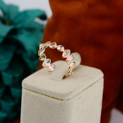 18K gold eternity ring with mixed-cut rainbow moonstone stones