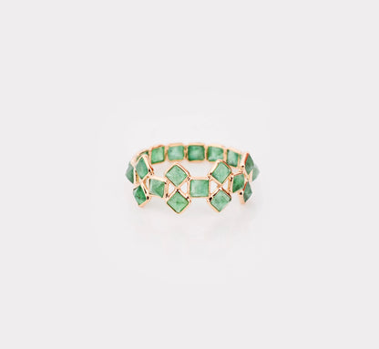 18K gold eternity ring with square-cut emeralds in a checkerboard lattice pattern
