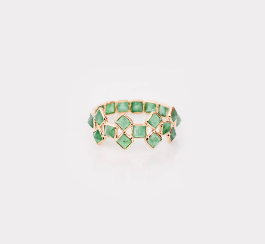 18K gold eternity ring with square-cut emeralds in a checkerboard lattice pattern