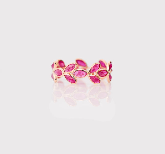18K gold eternity ring with marquise-cut rubies in a floral vine design