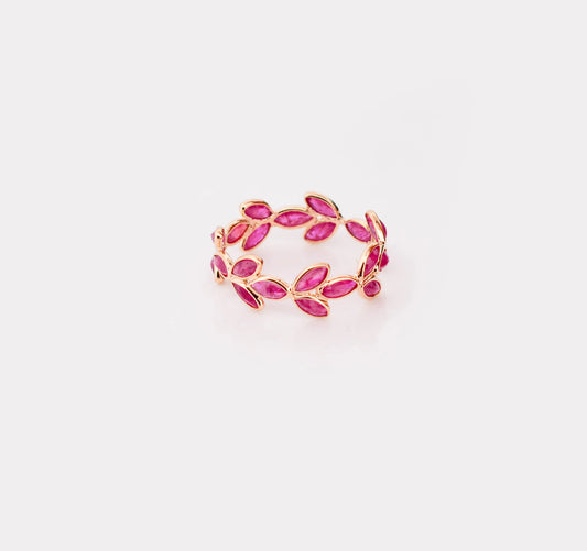 18K gold eternity ring with marquise-cut rubies in a floral vine design