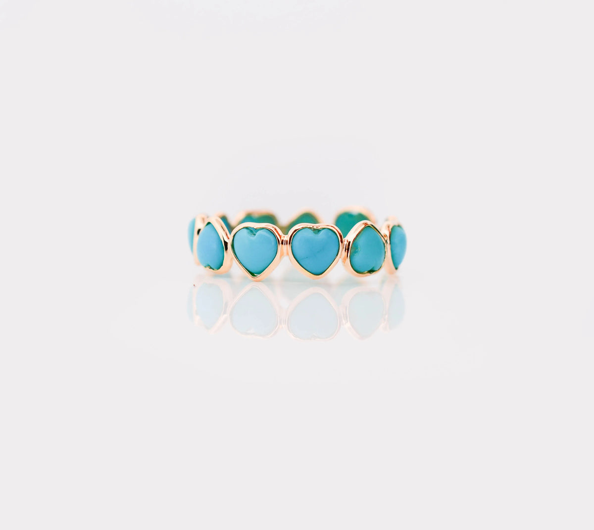 18K gold eternity ring with heart-shaped turquoise cabochon stones
