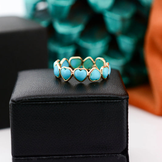 18K gold eternity ring with heart-shaped turquoise cabochon stones