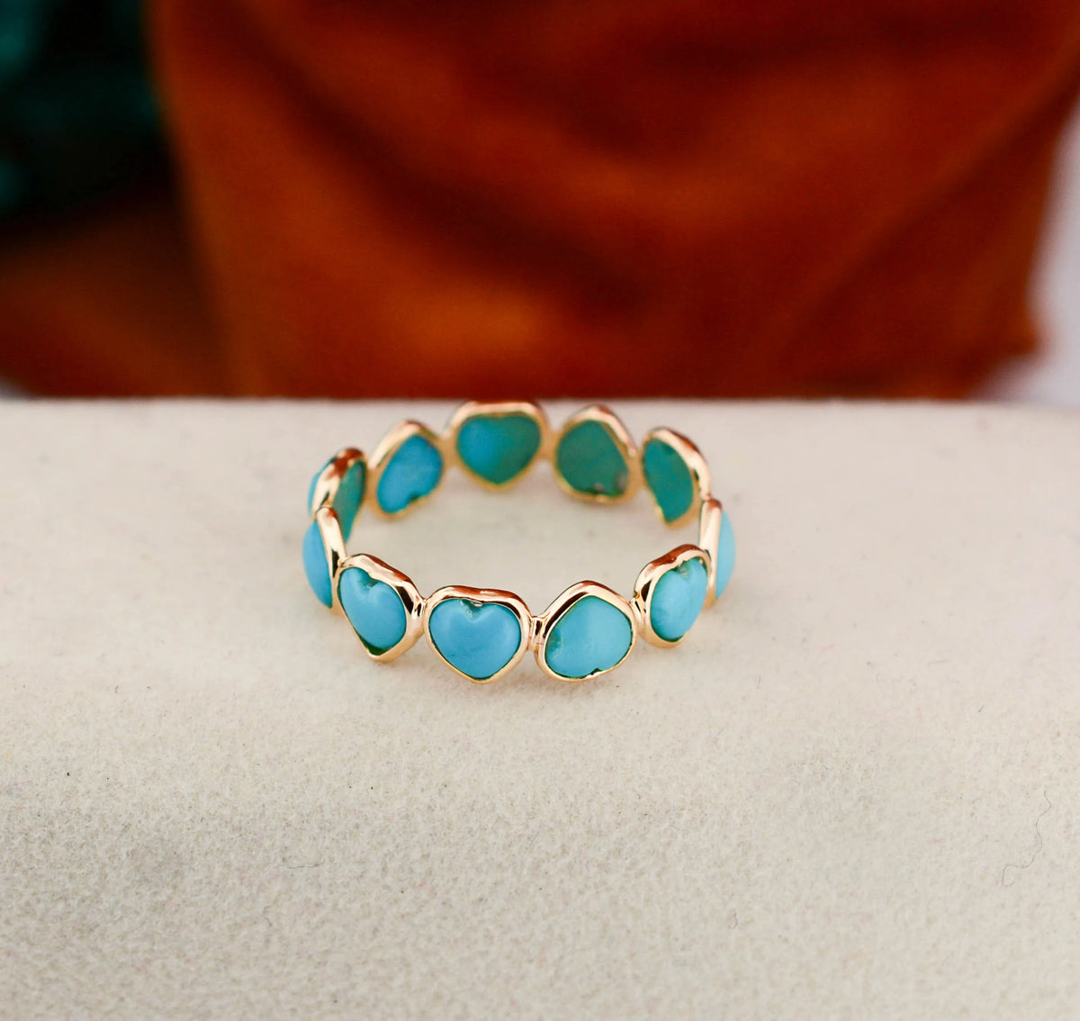 18K gold eternity ring with heart-shaped turquoise cabochon stones