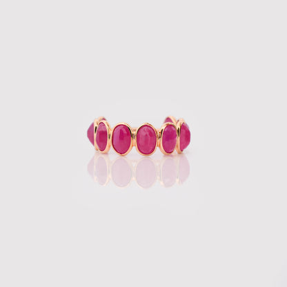 18K gold eternity ring with bezel-set oval-cut rubies