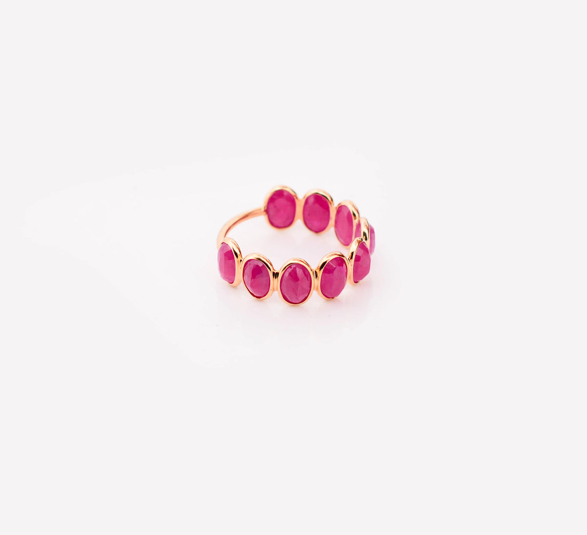 18K gold eternity ring with bezel-set oval-cut rubies