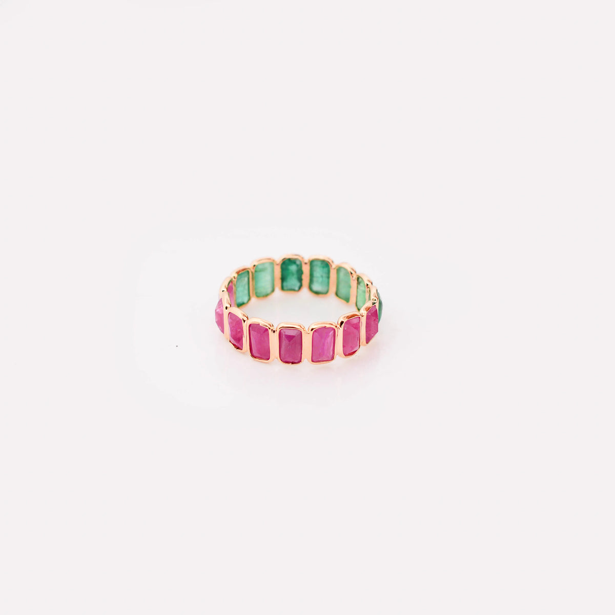 18K gold eternity ring with emerald-cut emerald and ruby stones in a two-tone design