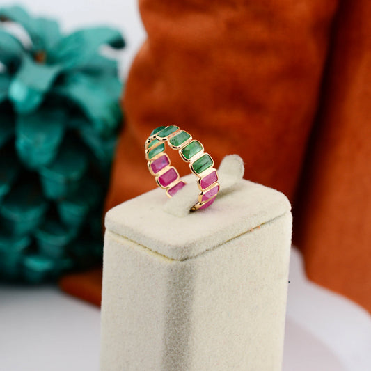 18K gold eternity ring with emerald-cut emerald and ruby stones in a two-tone design